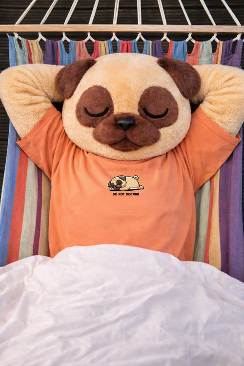 Plush Pug Mascot with a face on an orange shirt in a hammock